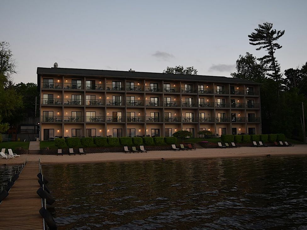 View of hotel exterior from lake dock at night